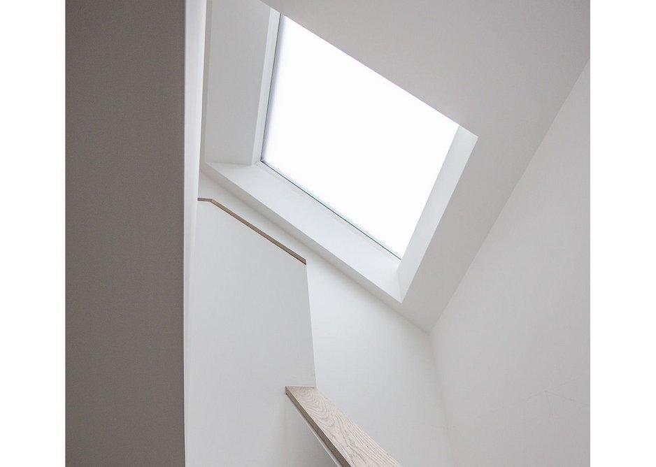Cutting the original three storeys to two had its advantages – ensuring the roof space was used to the full inside, as here above the stair.