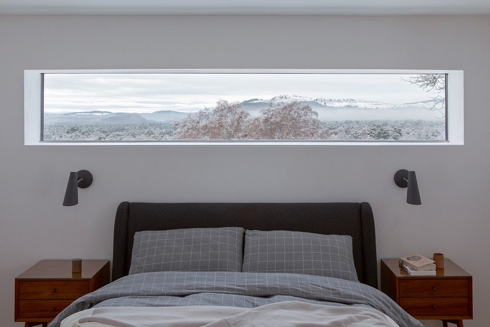 One ground floor bedroom in the old farmhouse has a horizontal window punched in.