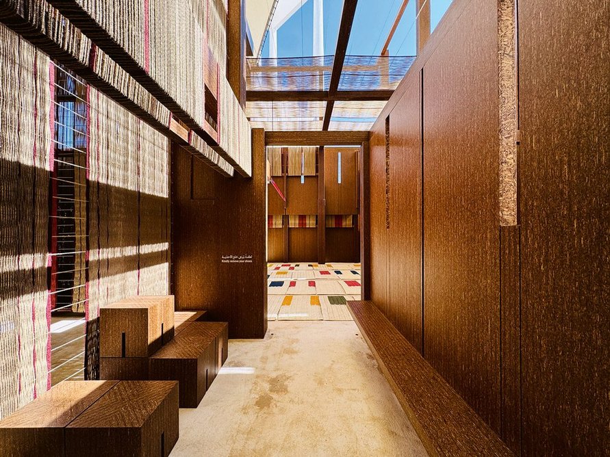 On Weaving, by East Architecture Studio. The modular structure allows reuse and is intended to resemble a loom; gaps in the facades filter and diffuse daylight.