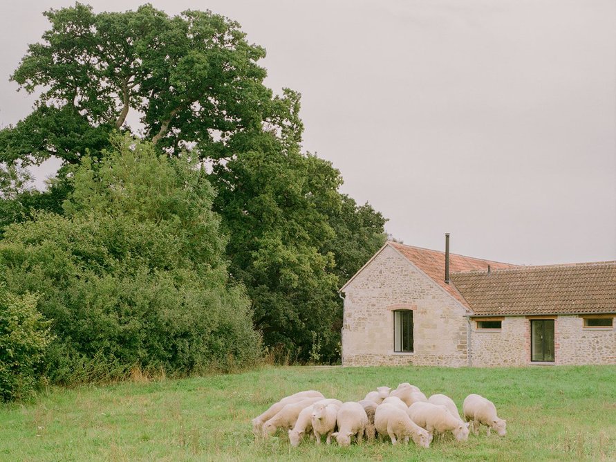 To the north, the complex overlooks pasture and woodland.