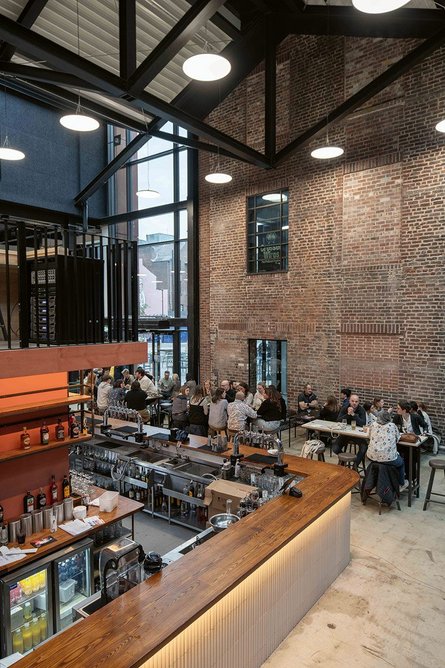 Inside the Cambridge Street Collective food hall, where FCBS has created a vast multi-storey space beneath a new roof.