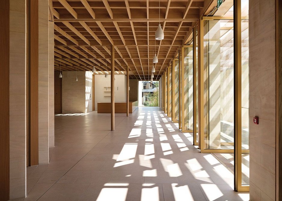 Slender timber columns reach up beyond the dappled light of the pergola. Grids and vanishing points all seem to take you somewhere beyond the cool interior.