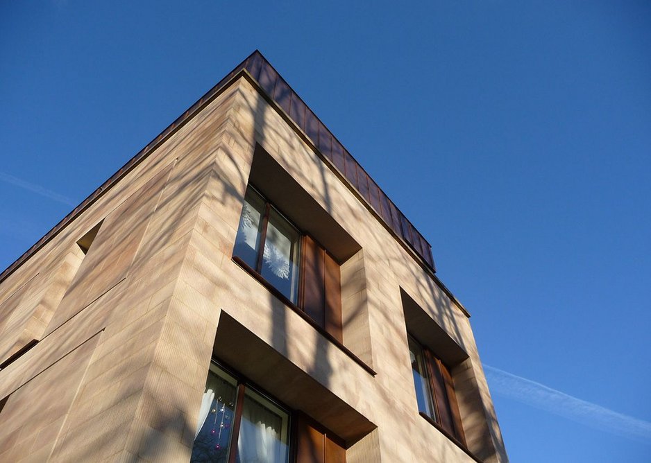 Deep-set window apertures with copper details including sills