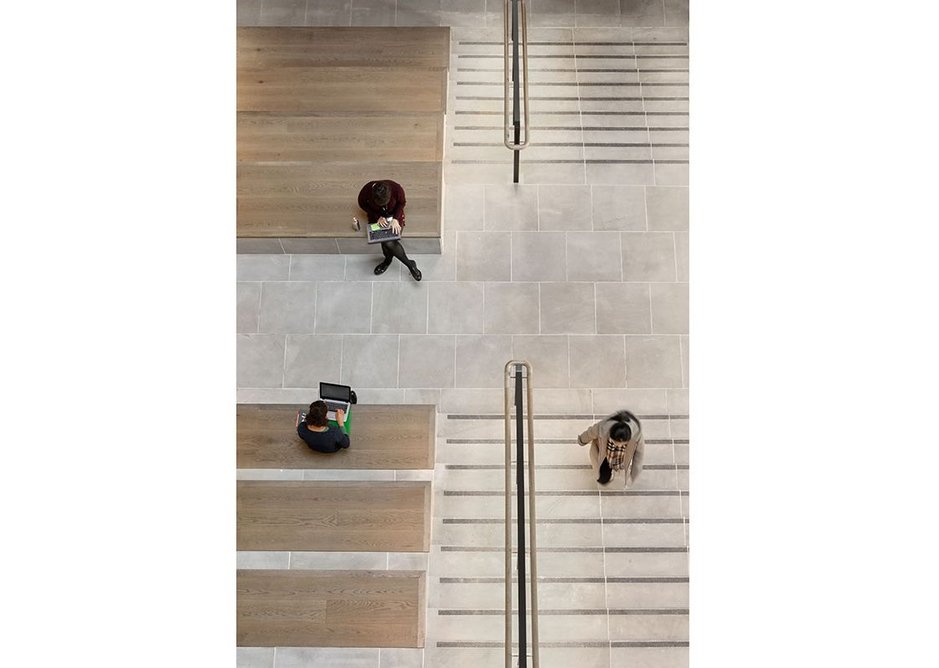 The auditorium steps from above with its York stone floors and oak timber seating.