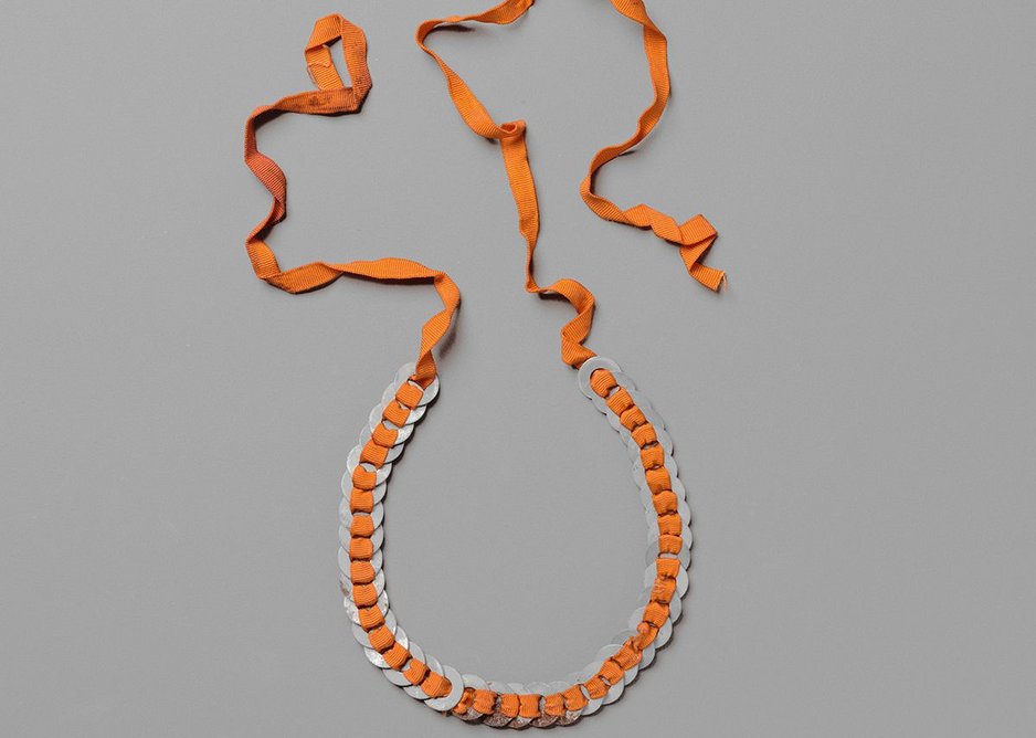 Necklace c1940, Anni Albers. Aluminium washers and red grosgrain ribbon.