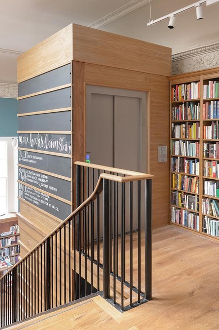 The lift up to the mezzanine (and down to the basement) is treated as a piece of furniture.