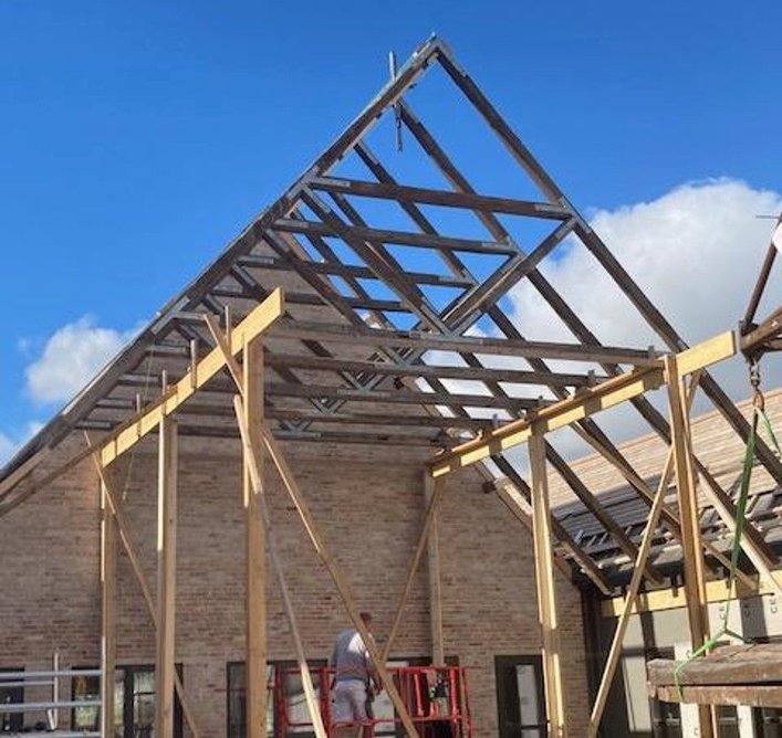 Salvaged trusses were installed in the ‘new’ school buildings.