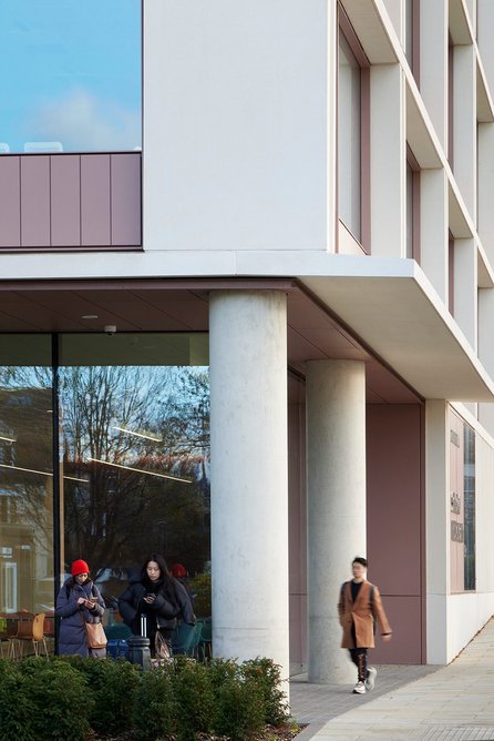 Receded ground-floor glazing creates a porch area.