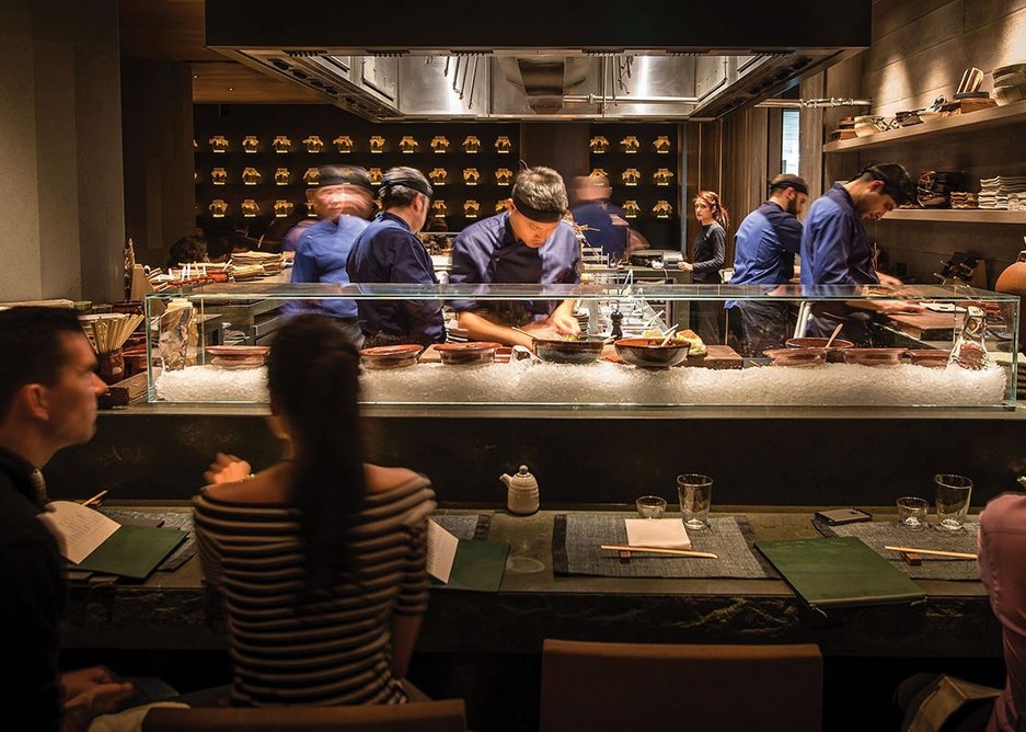 Chefs are prominent in the open kitchen at Roka Aldwych in central London, designed by Claudio Silvestrin Architects.