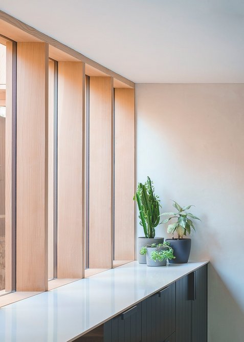 A glazed screen wall overlooks the new courtyard.