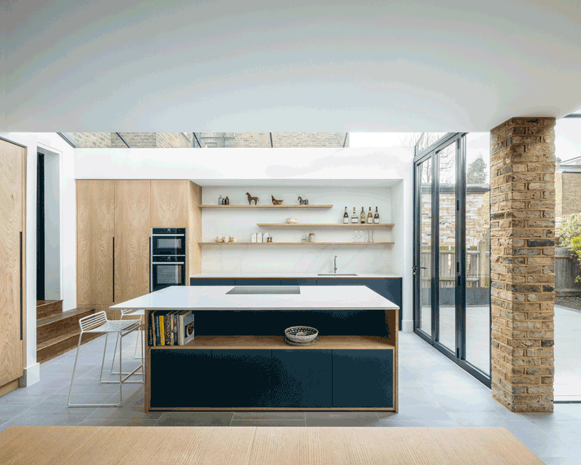 The highly glazed kitchen extension has dramatic light and height.