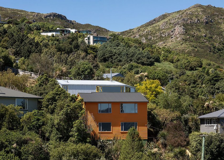 In bright signal orange, Toto Whare stands out from its state house neighbours.