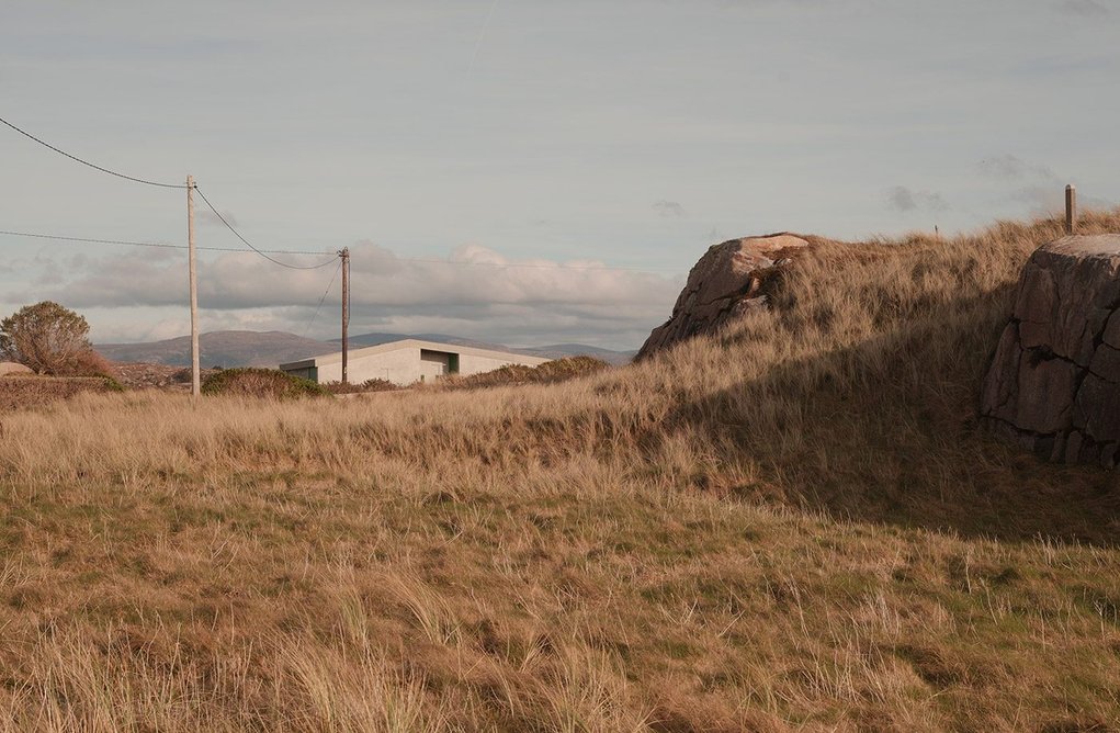 The house has been designed to hunker down into its surroundings.