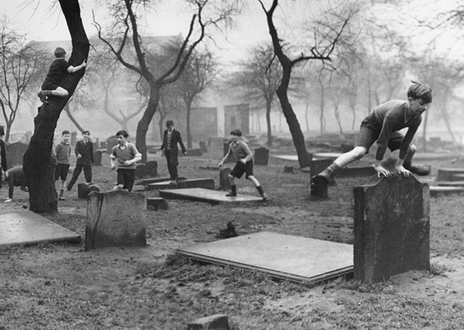 Boy leap-frogging gravestone, Bert Hardy, 1948.