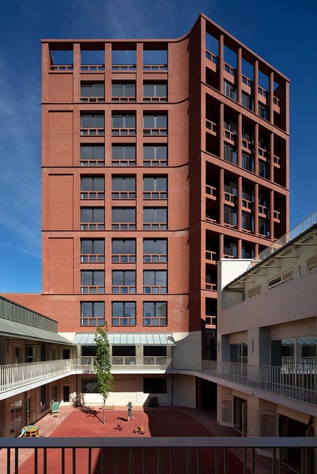 The courtyard at the centre of the scheme for the school, the apartments in the tower behind.