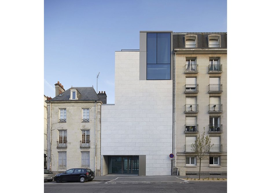 The administration and archive building on Rue Georges Clemenceau, along the street from the main entrance.