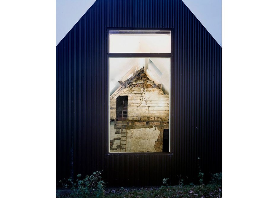 The new building encloses the existing 17th century cottage at Croft Lodge Studio, Leominster, designed by Kate Darby Architects and David Connor Design