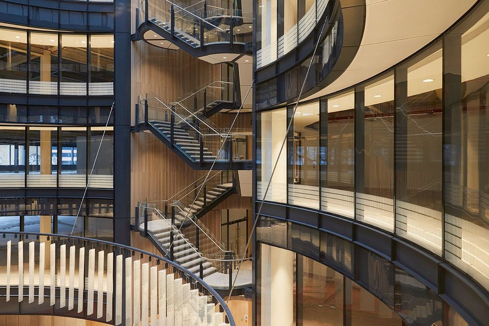 To aid orientation, open stairs create visual connections between lift lobbies and the tapering atrium.