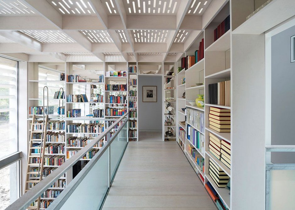 To access the upstairs bedrooms, you cross the library’s dazzling mezzanine.