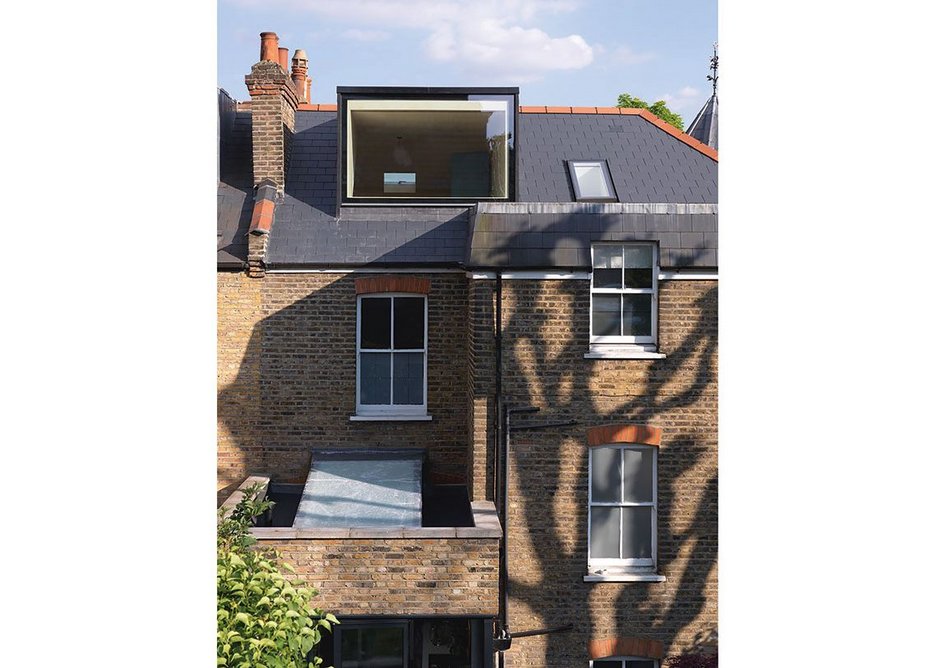 An expansive dormer opens up the ‘treehouse’ conversion of this top storey bedroom.