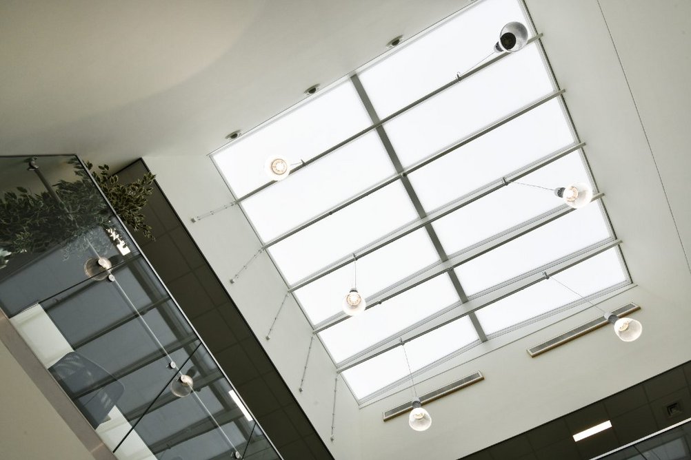 The library's Velux Commercial Modular Skylights Ridgelight at 5° with Beams seen from below.
