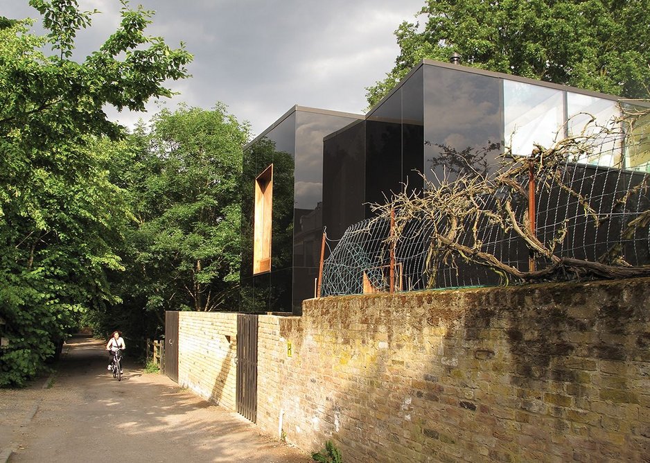 North elevation with the copse beyond. The high level west rooflight with solar coatings gives great views but without vents results in significant heat gain.