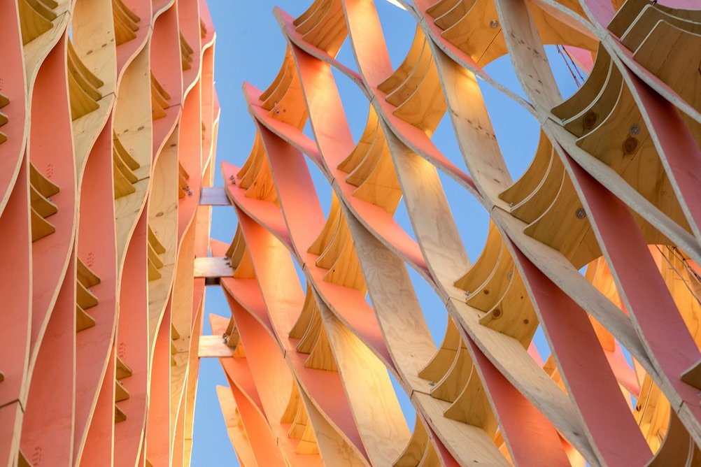 The sculpture is arranged in a radiating circle and the blue and pink colour scheme picks out light qualities of the Coachella Valley.