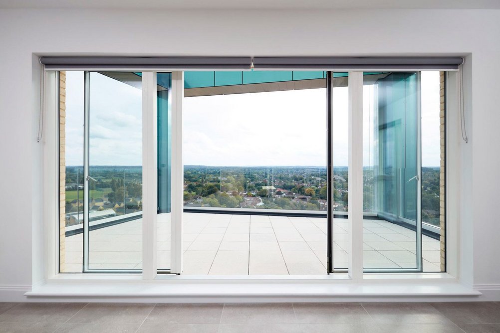 Velfac patio doors open out on to a balcony at Perigon Heights.