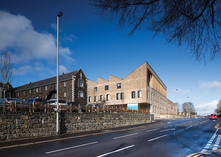 The new Health and Care Centre has an abrupt relationship with the road in contrast to the neighbouring former workhouse, although even the perimeter wall there has been raised as part of the recent works.