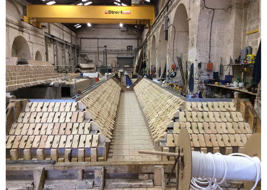 How they made it 2 - cut bricks being laid in precast formwork.