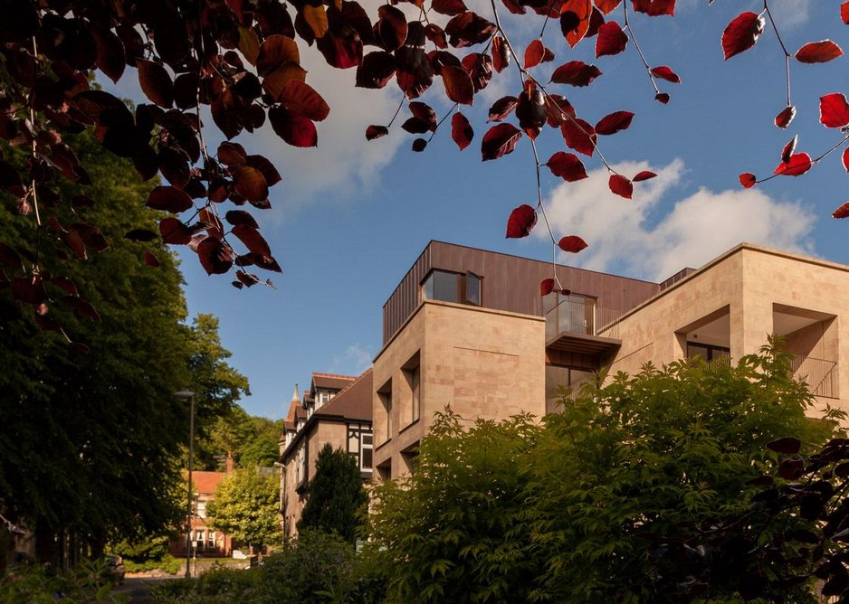 The park edges provide a green foil to the new building