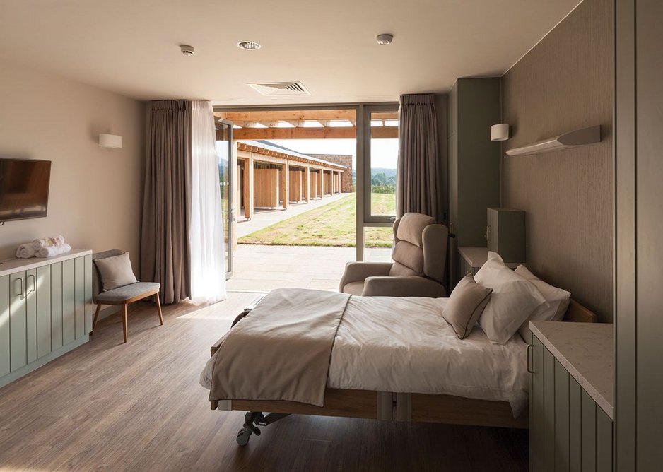 Above Bedrooms are calm spaces, designed with the ‘patient’s elevation’ kept in mind. Fully opening bifold doors mean patients can be taken out into the fresh air.