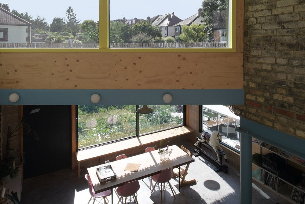 Upper levels within the triple-height space provide views out and down into the living areas.