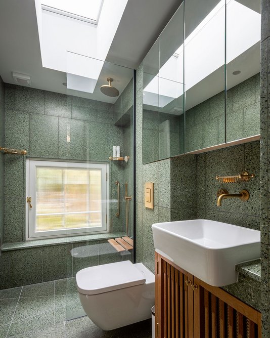 On trend but classic new terrazzo shower room with unpolished Aston Matthews brass fittings.