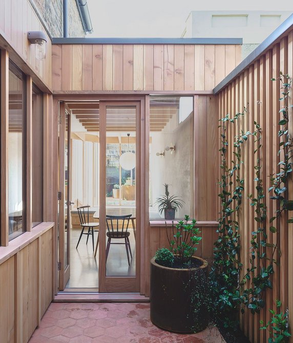A small courtyard sits between the piano room and kitchen.