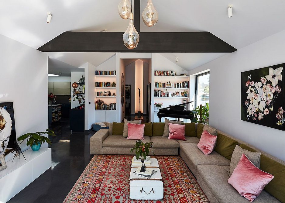 View looking back from the living room through to the hallway and kitchen, designed by Enhabit.