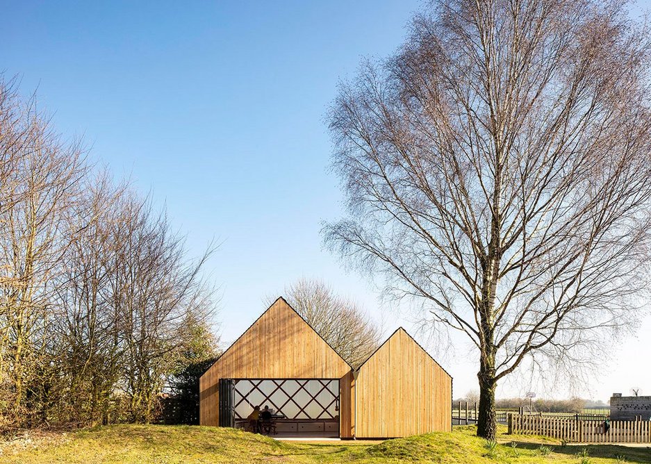 The double-pitched form of St. John's School Music Pavilion was inspired by the vernacular of local agricultural buildings at Lacey Green, Buckinghamshire.
