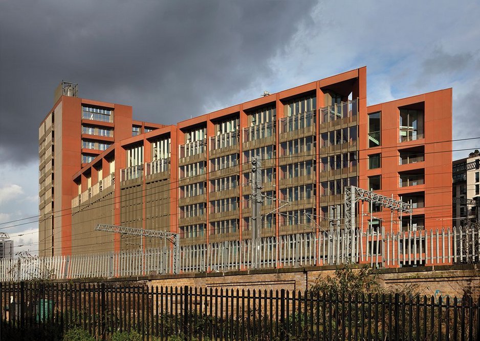 Glazed-in balconies are used on the western facade overlooking the railway tracks.