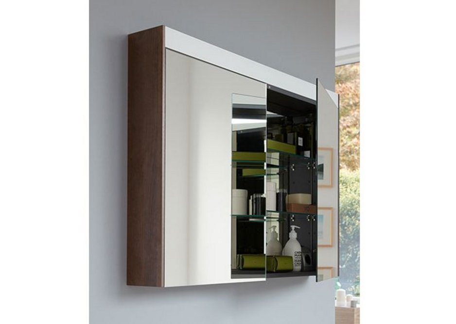 With a luminosity of at least 300 lux, Duravit's Brioso mirror cabinet with LED light band guarantees the user a perfect and uniform illumination. Cabinet sides match furniture finishes, here in Chestnut Dark.