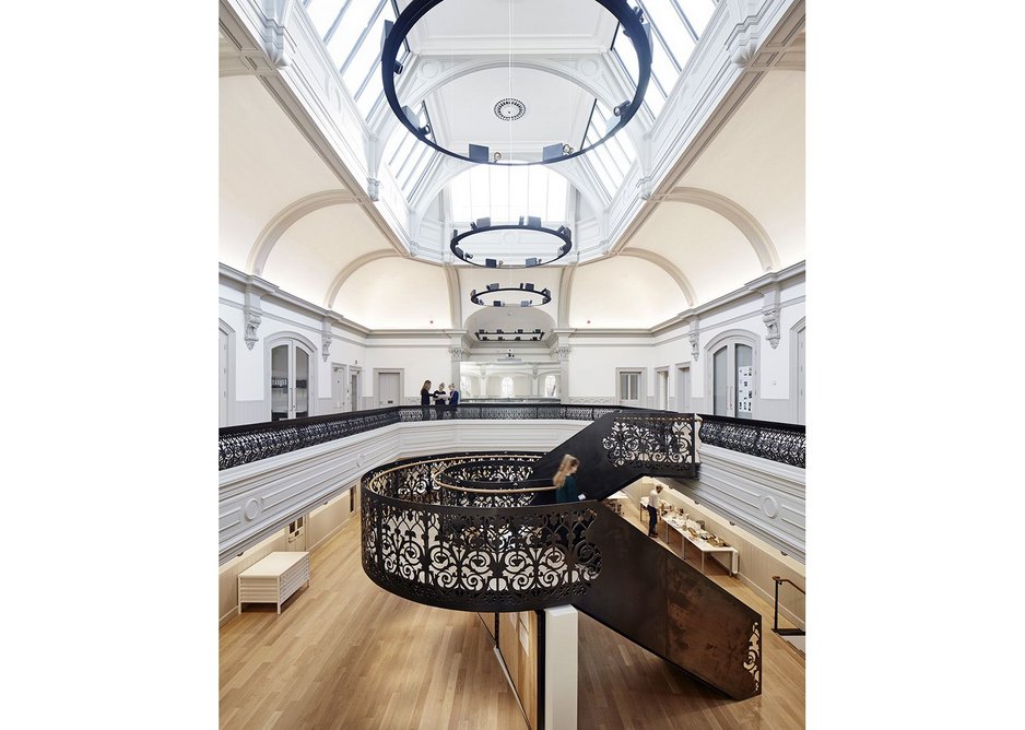 Scrolls and tendrils of the old balcony and new staircase.