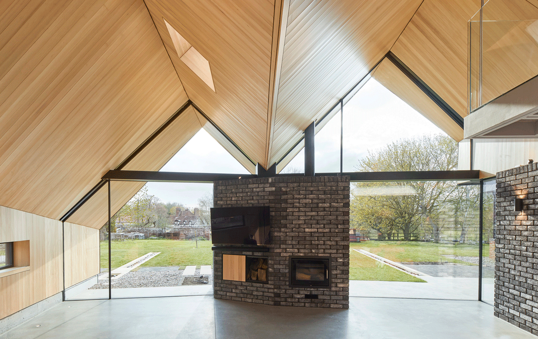 The folding roofline shapes are crafted and lined in silver fir timber and acoustic felt.