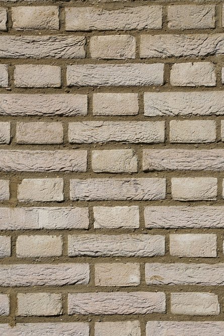 Creme brick by Vandersanden: Headers and stretchers are layered alternately in each course with headers centred on the stretchers of the course below.