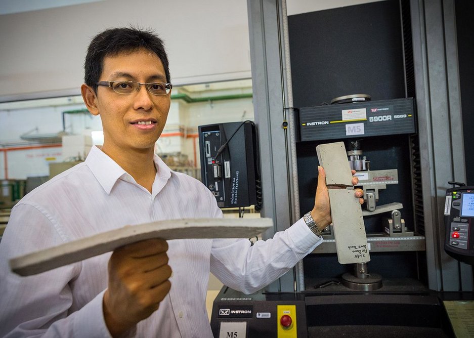 NTU Asst Prof Yang En-Hua holding the new bendable concrete in his right hand and the conventional concrete which broke on the left.