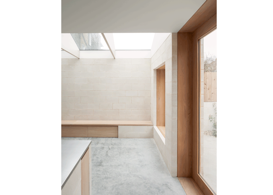 A two-storey extension to a Victorian terraced house at King’s Grove in south London is constructed from blockwork with oak windows and interior joinery.