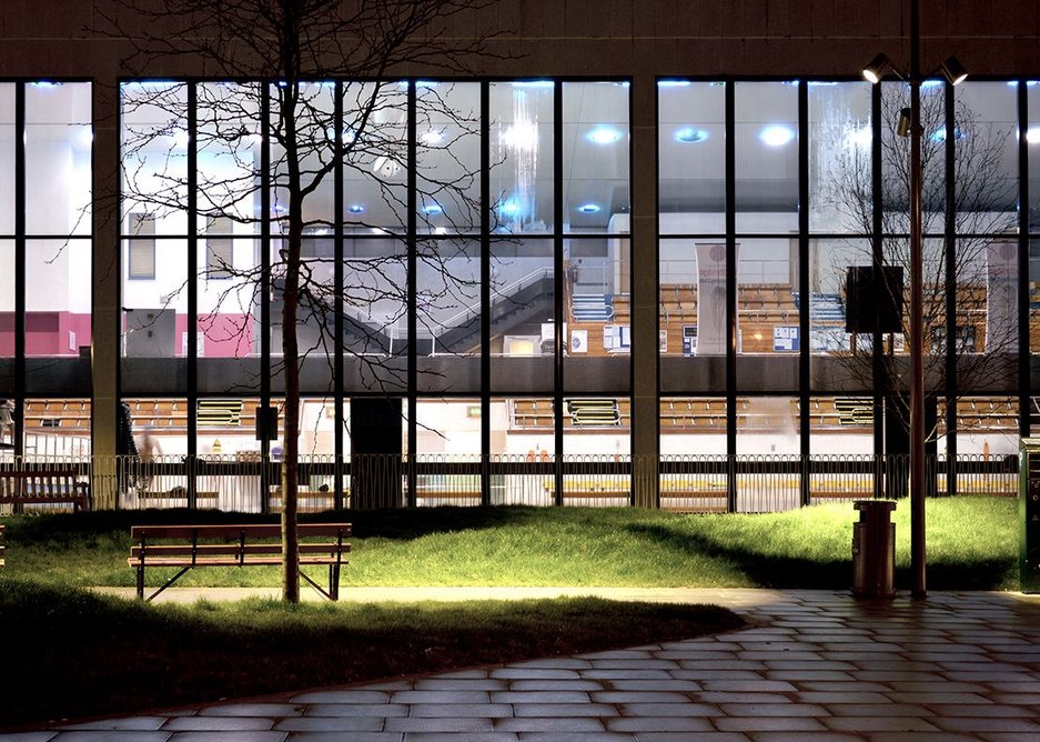 The gardens provide a night-time view of the leisure centre.