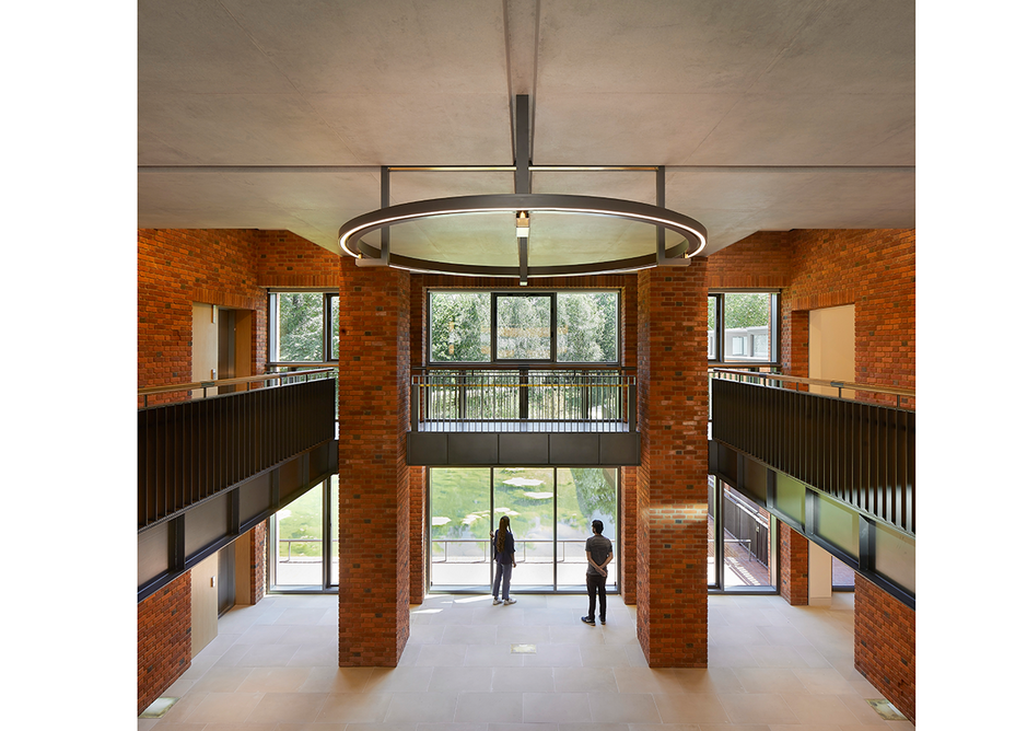 Restrained double-height foyer provides a glimpse of the gardens from the street. Credit: Hufton + Crow