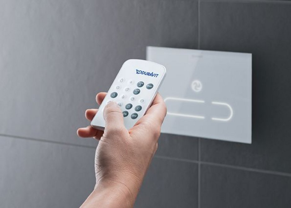 Duravit's DuraSystem electronic A2 toilet actuator plate has a remote control to coordinate functions.