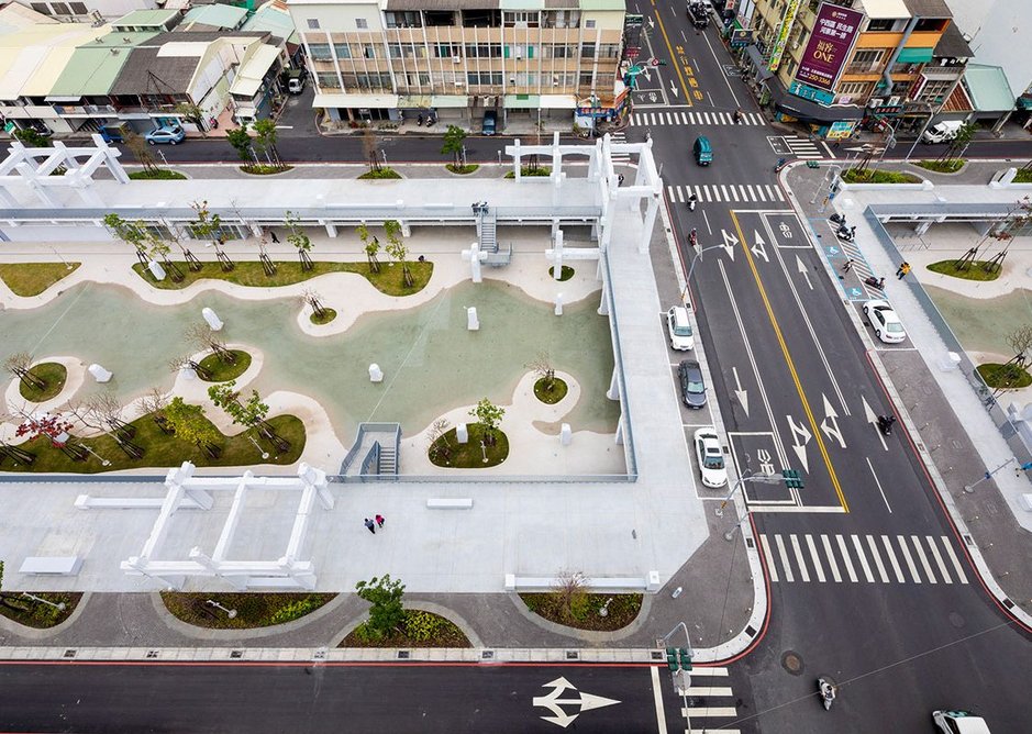 The new ground level has become a landscaped promenade overlooking the lagoon.