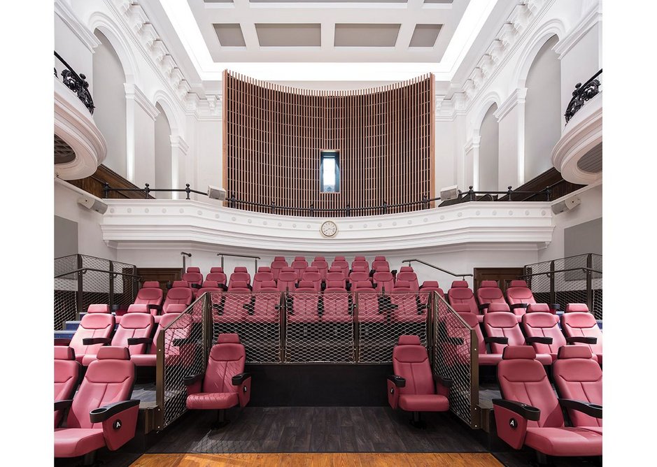 Remaining wall murals from the Old Town Hall were restored and reinserted into the conversion. Targeted downlights show them off to cinemagoers.