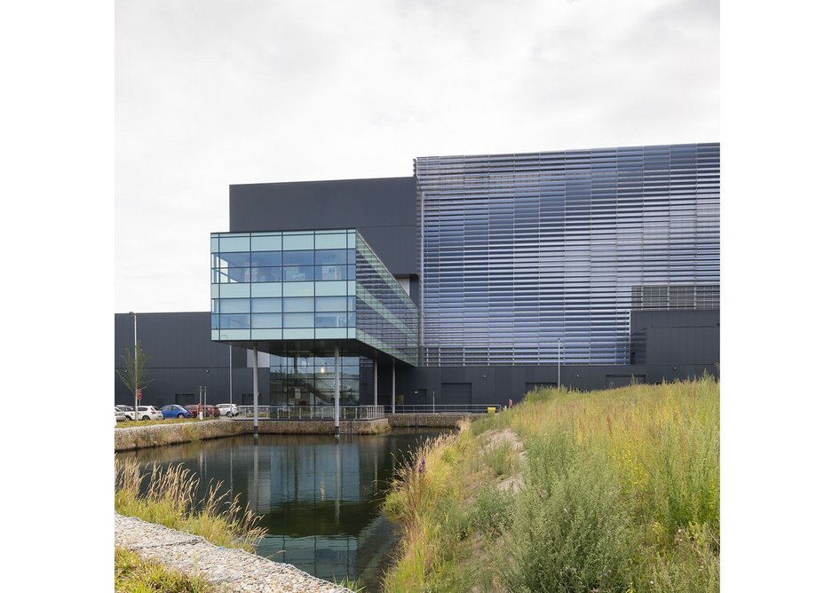 Visitors' centre and offices are elevated over a balancing pond and soft planting.